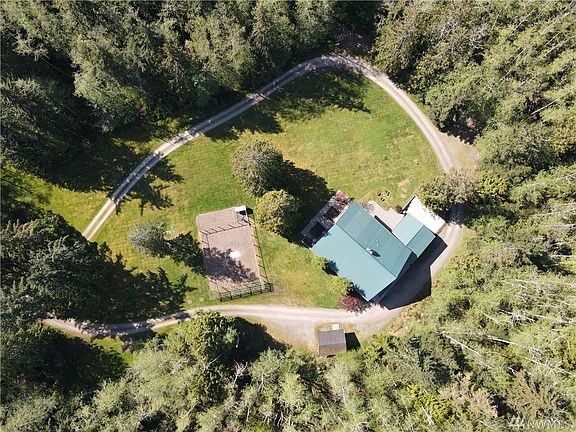 View from above showcasing the wraparound drive, garden and outbuilding