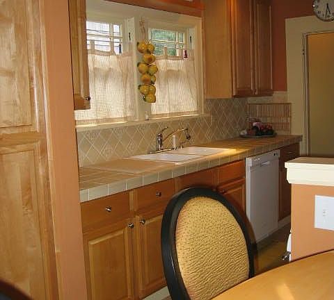 View of breakfast bar to kitchen