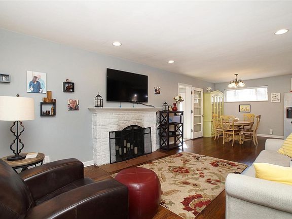 Solid wood floors, neutral paint, fireplace and lots of natural light welcomes you home.