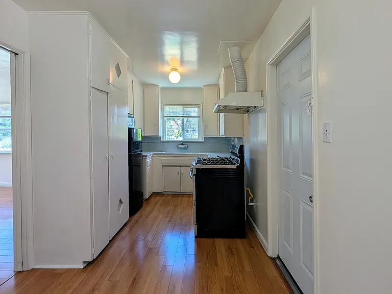 Kitchen (new stove with double ovens, refrigerator, and microwave)