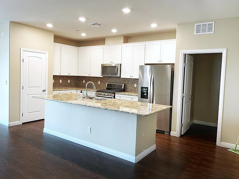 Kitchen all stainless appliances, marble island and counter tops