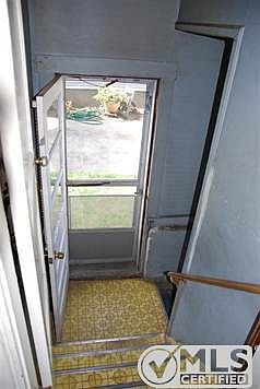 Steps to side door then to basement