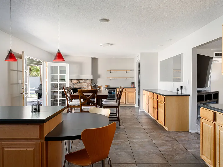 Eat-in dining with wine fridge and decorative fireplace