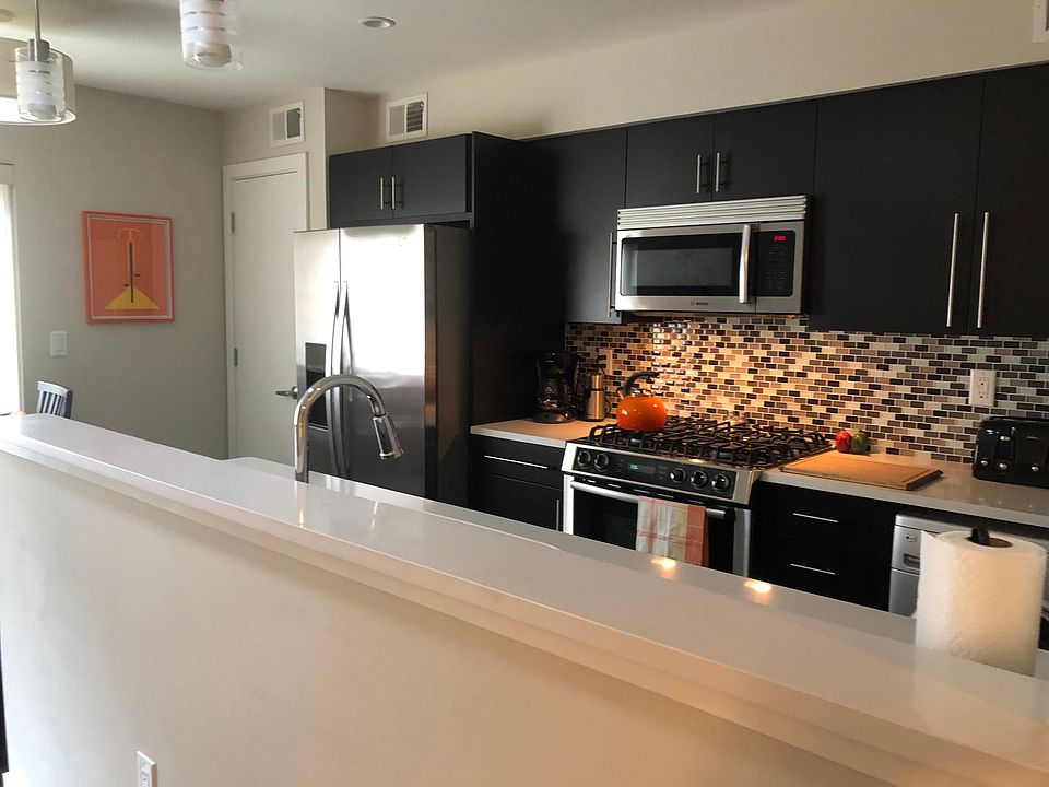Large galley kitchen with Bosch dishwasher and gas stove, LG washer/dryer, extra large stainless sink. Plenty of storage, including large pantry closet next to refrigerator.