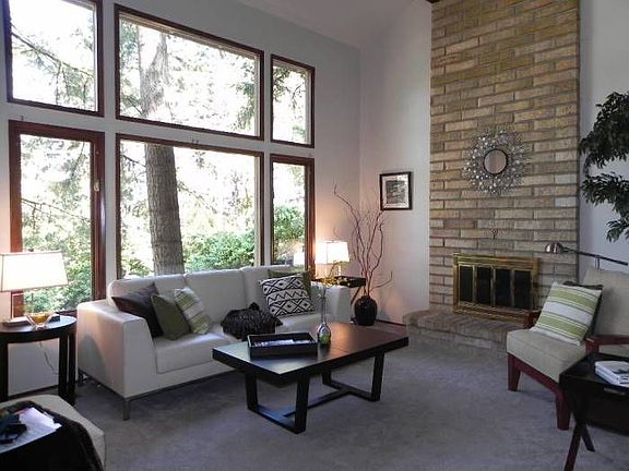 Living Room w/ Vaulted Ceiling and Fireplace