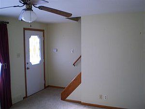 living room w/ front entry and the up-stairs