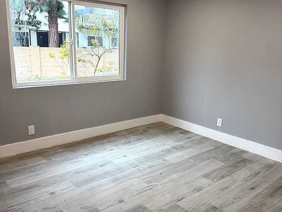 Bedroom with new porcelain tile and recess lighting