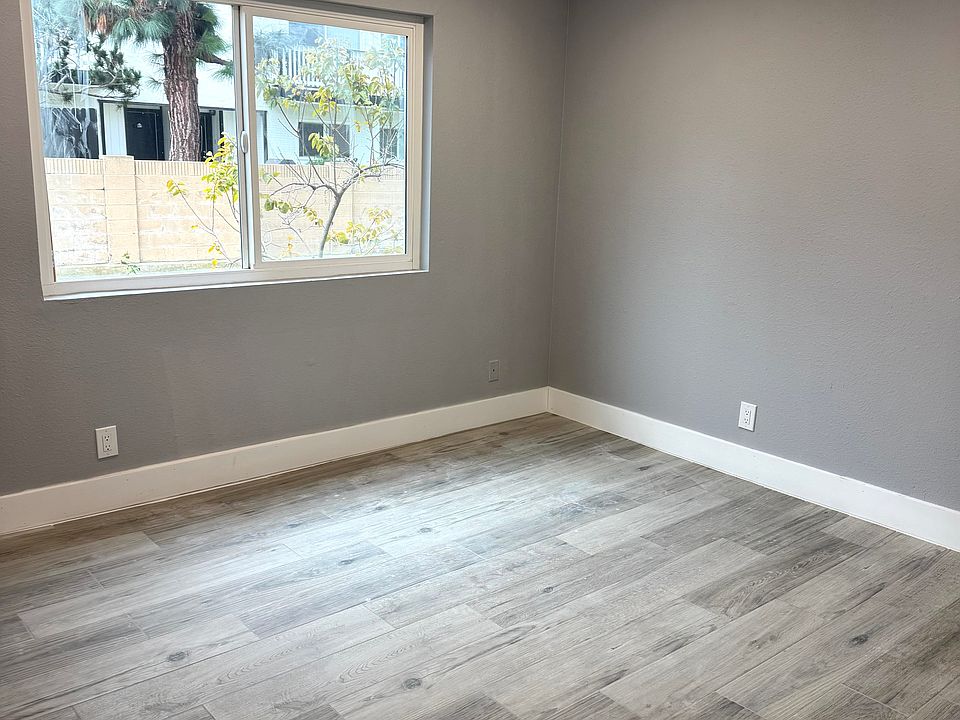 Bedroom with new porcelain tile and recess lighting