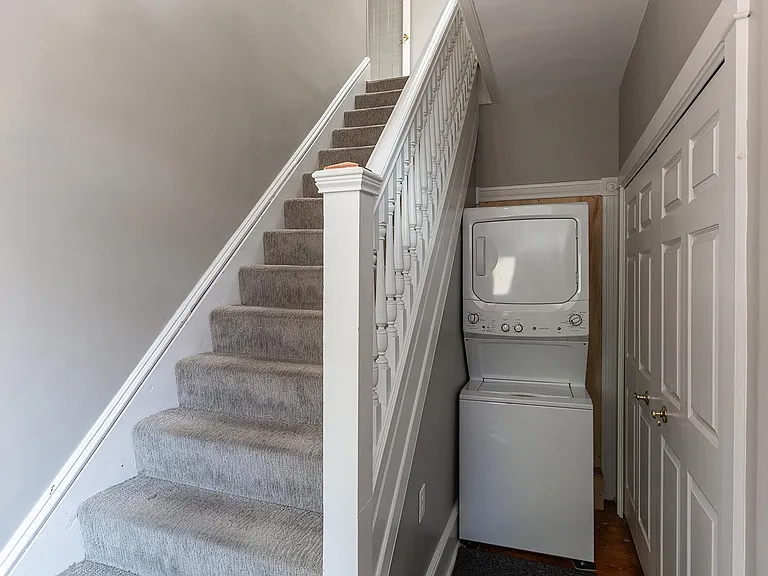 Entry hall with laundry and giant coat closet.