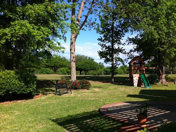 Spacious yard mature trees