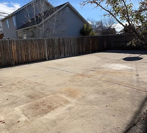Large Cement Pad behind garage. No direct access to park anything without going on grass