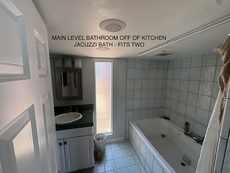 We've always used this bath in the bathroom off the kitchen to take baths in. The gigantic tile bath on the submariner level took literally 25 minutes to fill. You'd be welcome to keep lots of your stuff in this bathroom, as I rarely use it.