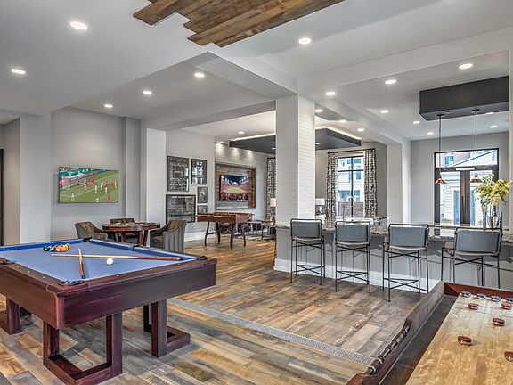 Sports Lounge equipped with billiards, poker table, shuffleboard and wall Scrabble