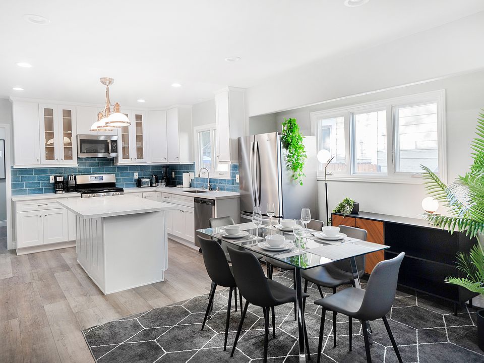 Open concept kitchen with island and dining area