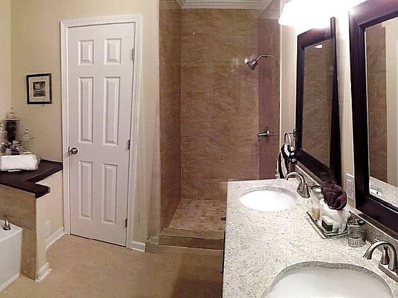 New master bath includes separate shower & tub, double vanity and private water closet.
