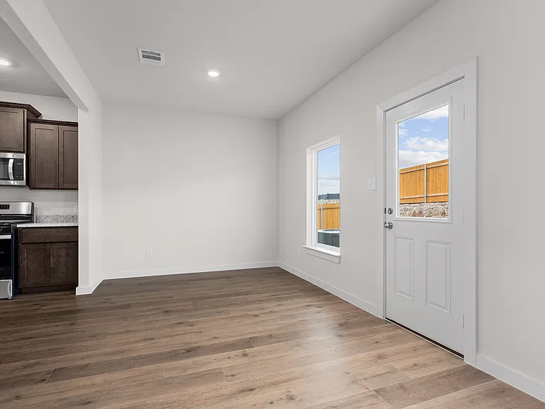The dining room has a large window that lets in great, natural light.