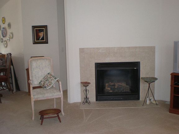 Living room has gas fireplace