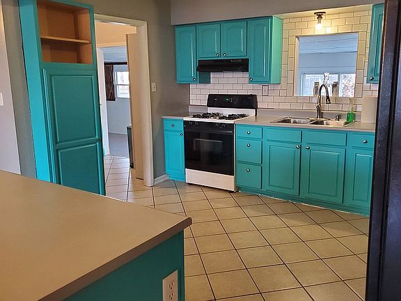 Tile backsplash and pantry.