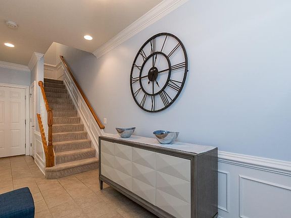 Entry way foyer - door to garage is past staircase through door