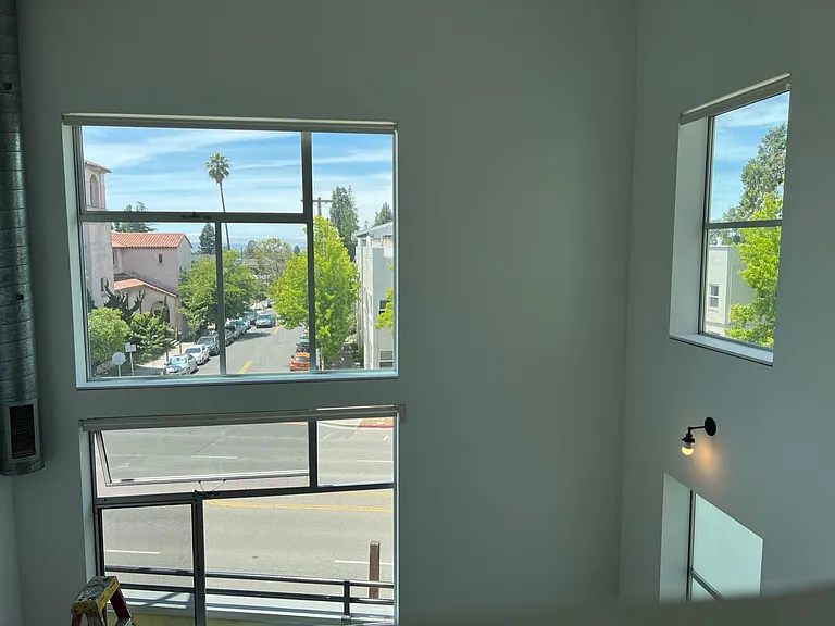 View towards the front window from the second floor. The bay can be seen at a distance.