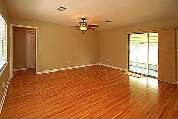 warm hardwood graces the livng room