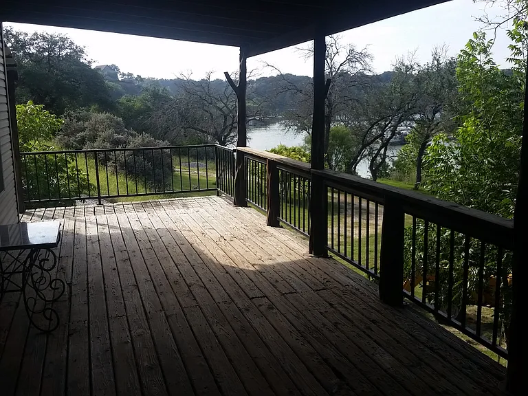 Deck wraps around with lake views