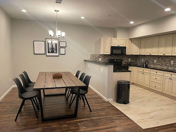 Dinning Table next to 2 tier kitchen island