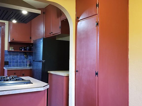Breakfast Nook showing cabinets and butcher block cart