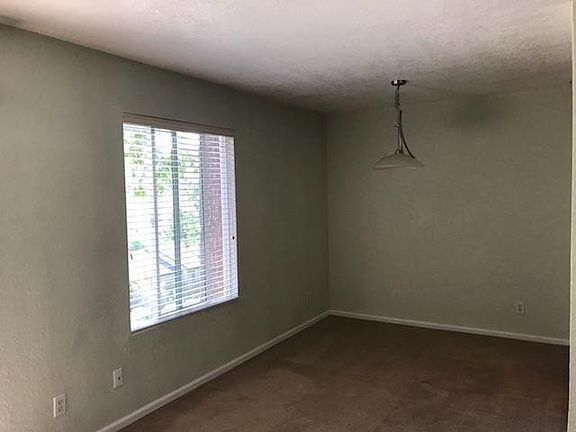 Roomy dining area with large window providing a view of Juanita and lake