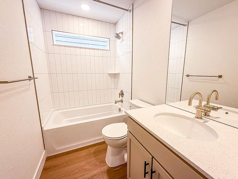 Downstairs Bathroom - Three full bathrooms with modern fixtures and clean, contemporary finishes.