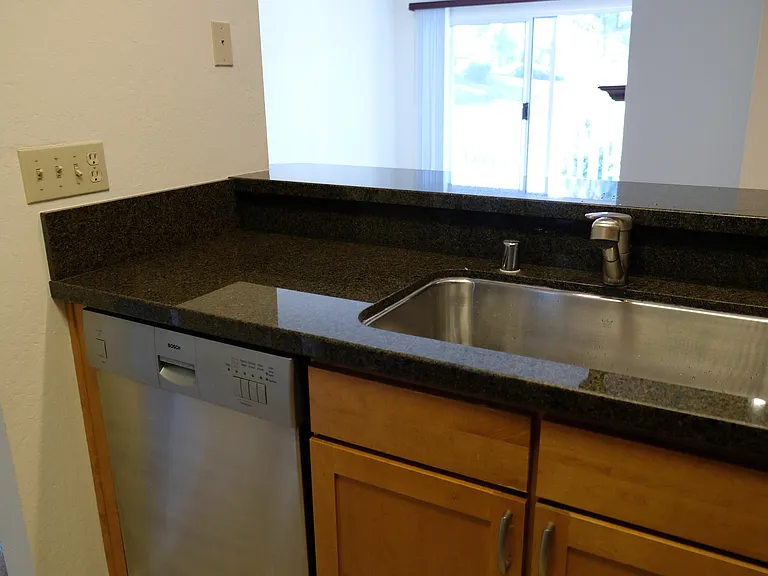 Kitchen view: looking out to living room.
