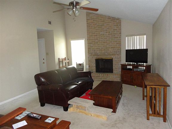  High ceiling in large living room feature with fireplace