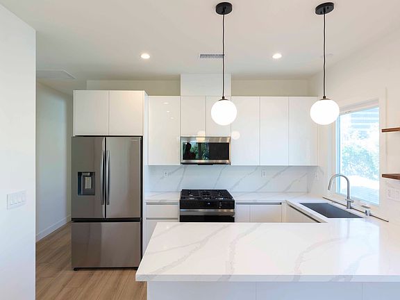 Modern kitchen with European-style cabinetry and stainless steel appliances
