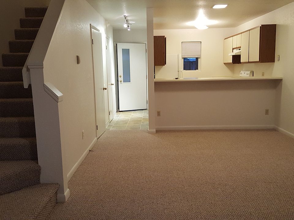 Living room looking back to entry and kitchen
