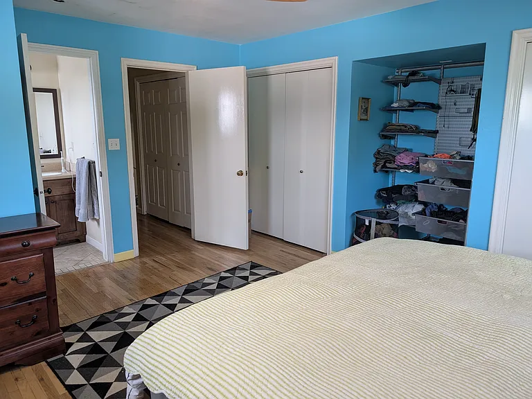 Master bedroom with en suite bathroom and closets