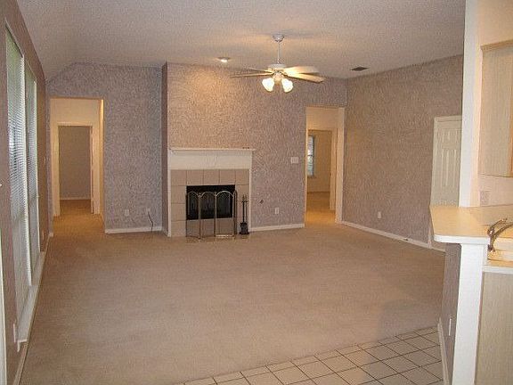 Living room w/ master on right & 2 bedrooms down a short hallway on left