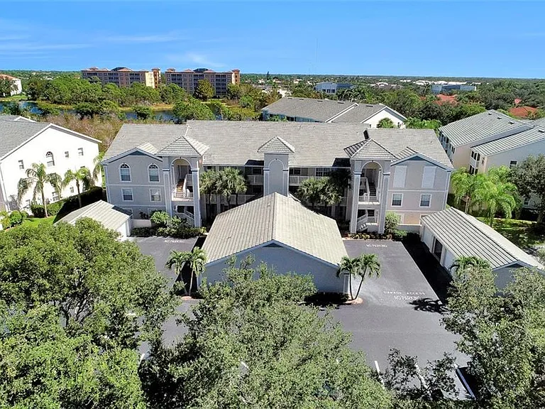View of building with garages out front. Garage for this unit is closest to the building.