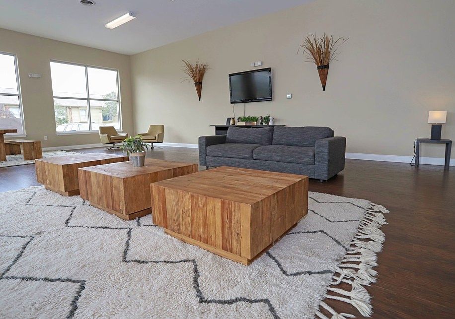 Comfortable clubhouse with contemporary furnishings, perfect for relaxing or social gatherings.