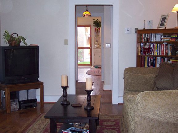 View from the entrance into the living room with original hardwood floors!