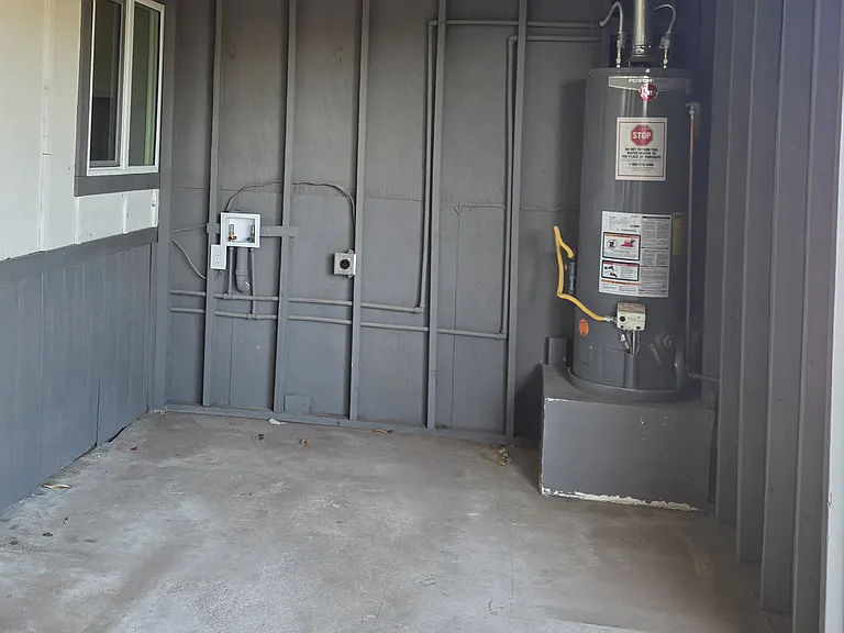 Open area washer/dryer hookups outside.