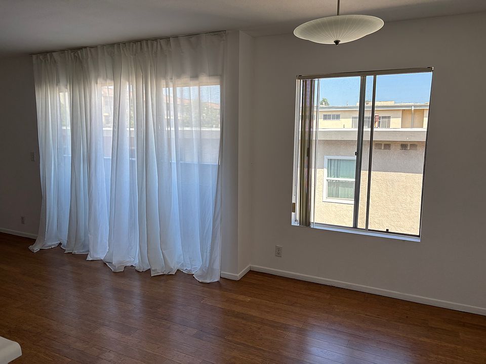 View from kitchen to dining area and balcony entrance.