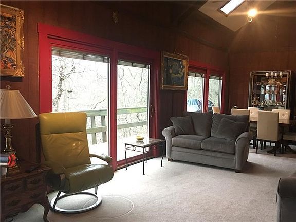 Another view of LIVING and DINING area showing view to outside.  Skylights.  The entire home is bathed in sunlight.  Internal bl