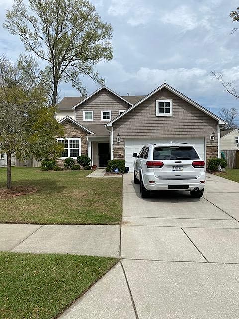 Well maintained yard across from a pond. Full 2 car garage