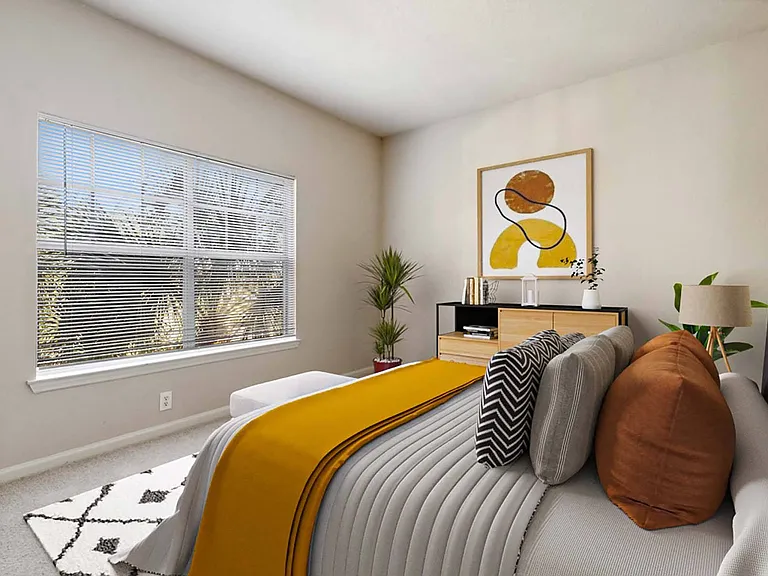 Bedroom with plush carpeting