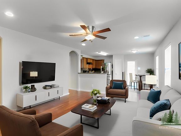 Front entry into the living, kitchen and dining room