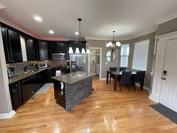 Granite counter tops, tiled back-splash.