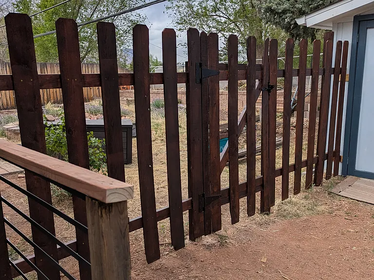 Gated entrance to both sides of back yard. Deer proof.