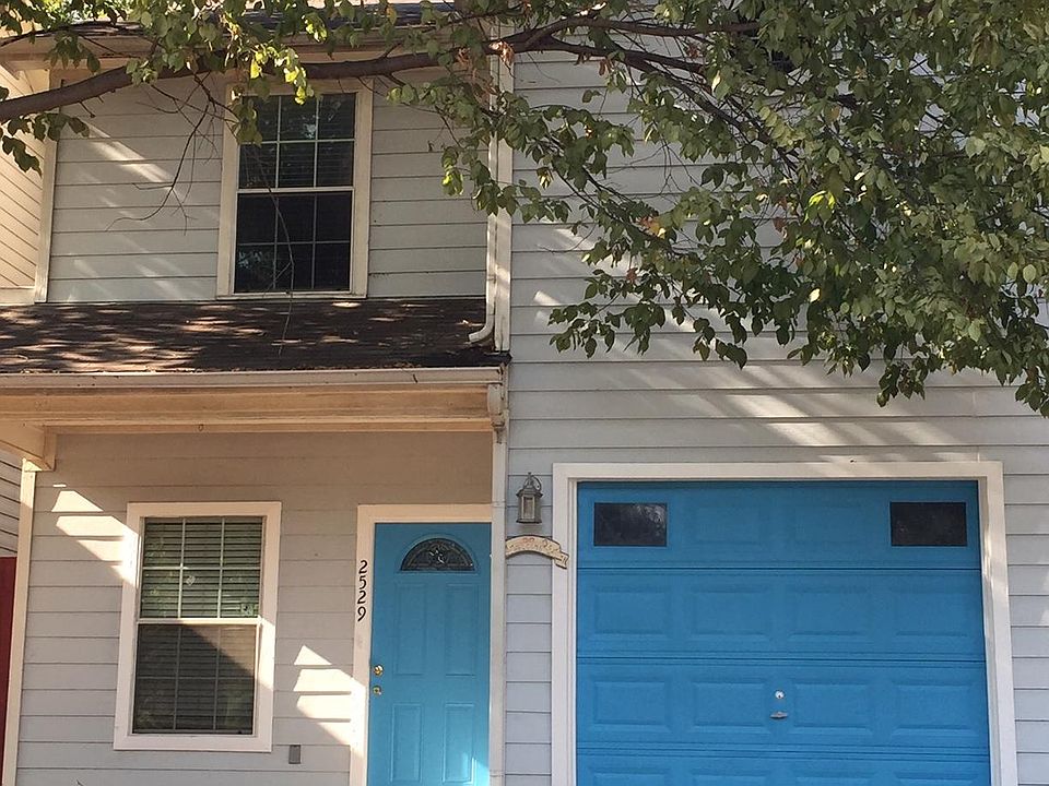 House Front. Main Door Entrance + 1-Car Garage Door.