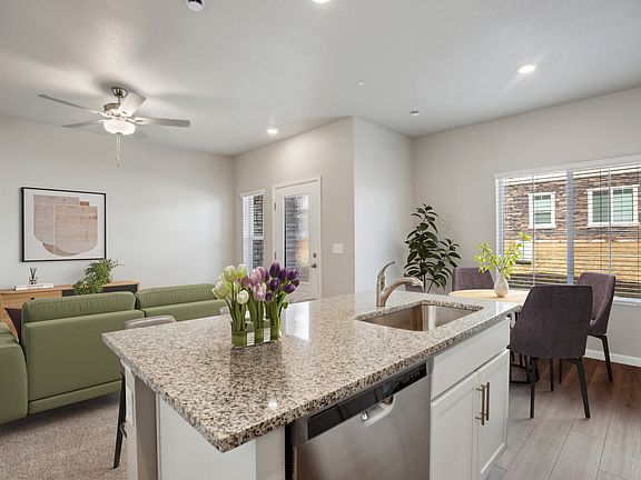 The dining room is off of the kitchen and open to the family room.