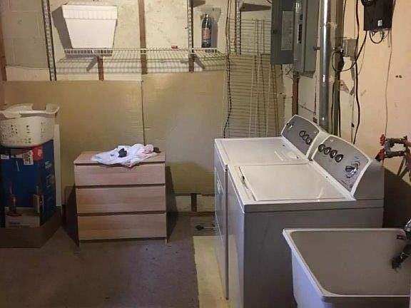 Private Laundry Room along with storage